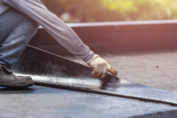Professional Waterproofing technician working in Westport, NC